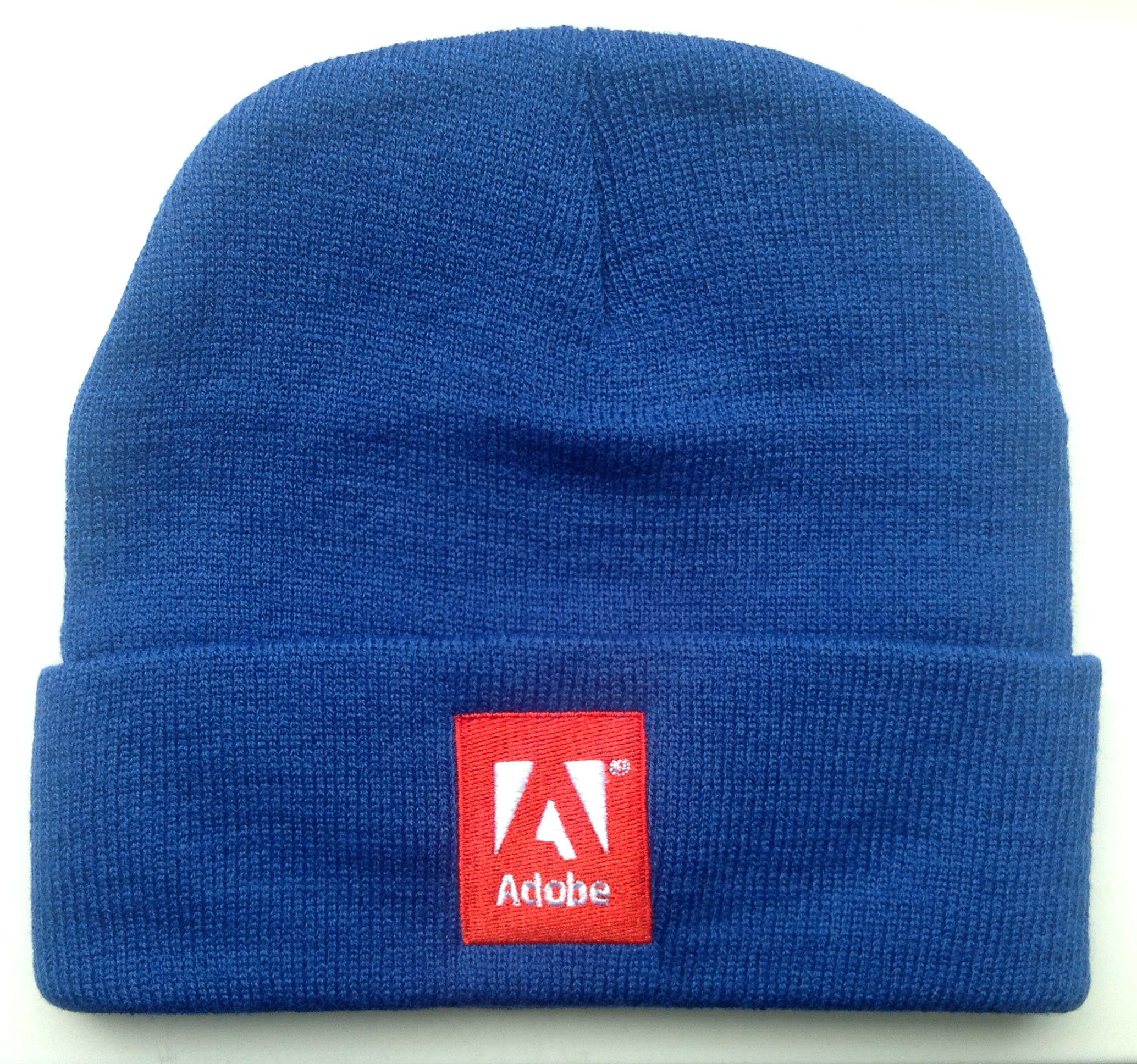 A blue beanie with Adobe logo